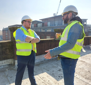 Cllr Thomas Kerr on a housing development site in Glasgow